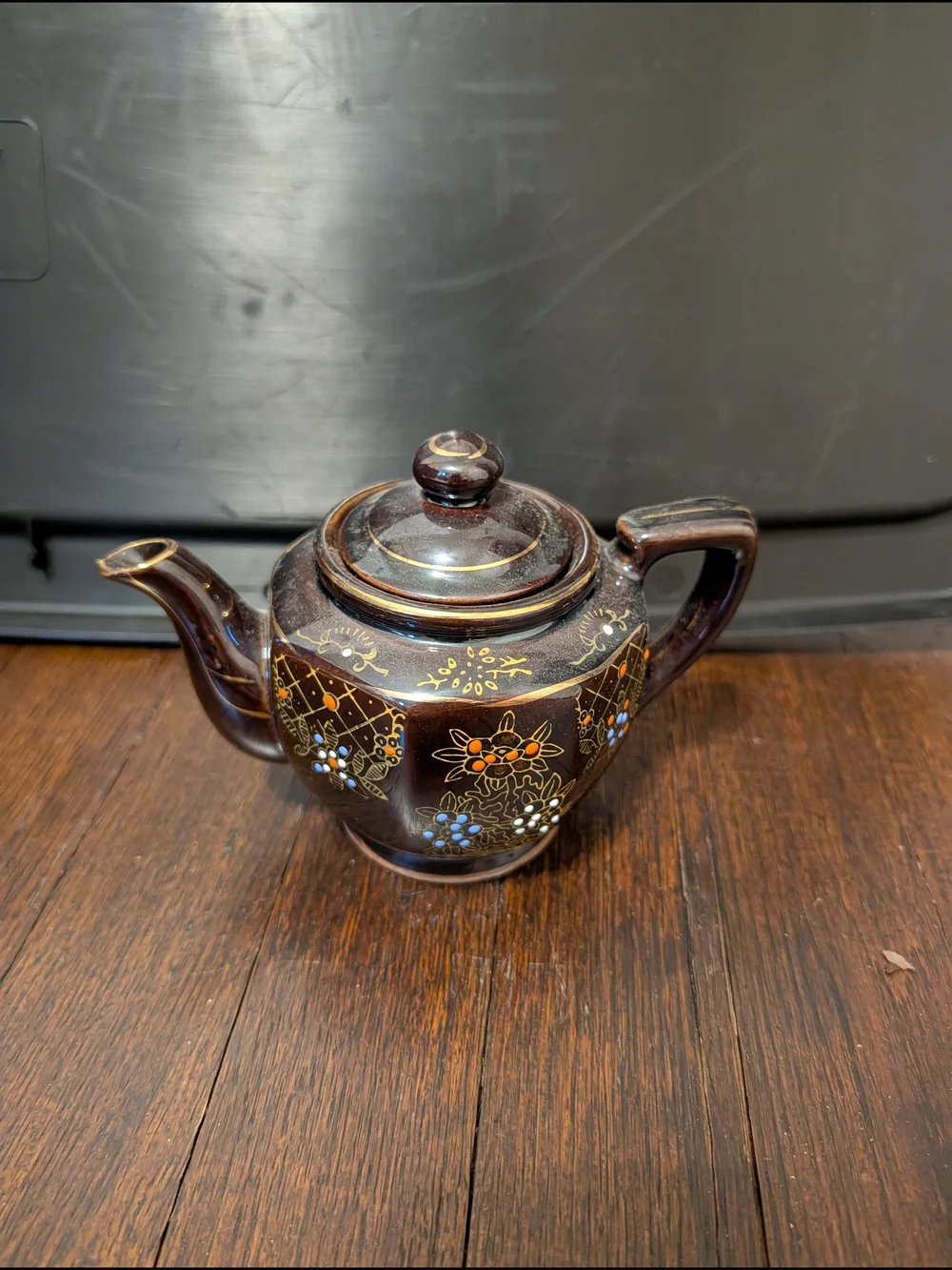 Brown Ceramic Teapot with Hand-Painted Floral Detail
